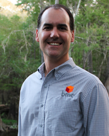 Dr. Wright standing outside in company button down during daytime